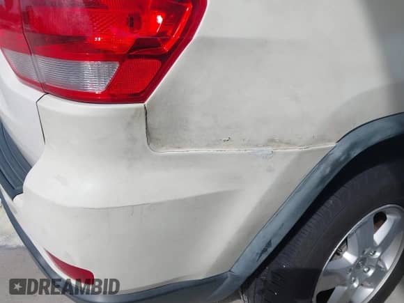 2012 Jeep Grand Cherokee Laredo z VIN 1C4RJEAG6CC227886, wystawiony jako IAAI lot #43547066 z przebiegiem 165 089 mil mil oraz . Historia ofert i sprzedaży dostępna na DreamBid. Obrazek 6.