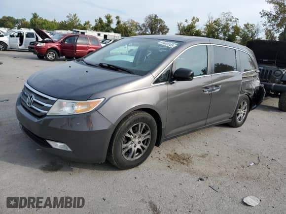 2013 Honda Odyssey EX-L с VIN 5FNRL5H65DB065311, выставлен на аукционе Copart как лот 81468745 с пробегом 188 718 миль миль и Списание • Salvage title. История ставок и продаж доступна на DreamBid. Изображение 1.