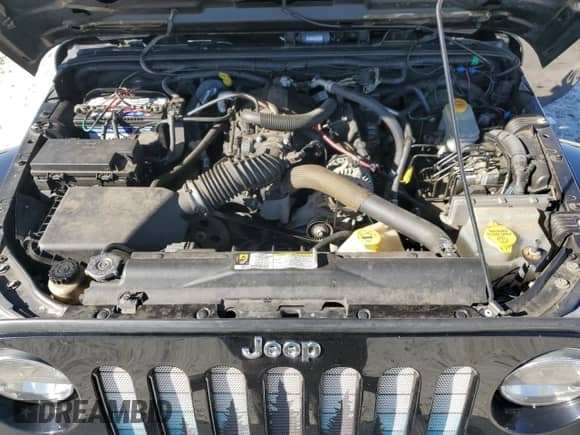 2010 Jeep Wrangler Sahara с VIN 1J4AA5D15AL152772, выставлен на аукционе Copart как лот 84934065 с пробегом 158 263 миль миль и Списание • Salvage title. История ставок и продаж доступна на DreamBid. Изображение 12.