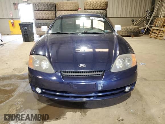 2003 Hyundai Tiburon GT с VIN KMHHN65F43U075197, выставлен на аукционе Copart как лот 52617655 с пробегом 117 561 миль миль и Списание • Salvage title. История ставок и продаж доступна на DreamBid. Изображение 5.