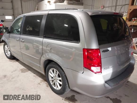 2014 Dodge Grand Caravan SXT with VIN 2C4RDGCGXER263963, listed as a IAAI auction lot 41956264 with 138,815 mi miles and . Bid and sale history available at DreamBid. Image 3.