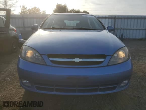 2005 Chevrolet Optra с VIN KL1JK69Z55K217355, выставлен на аукционе Copart как лот 76715574 с пробегом 111 798 миль миль и Чистый • Clean title. История ставок и продаж доступна на DreamBid. Изображение 5.