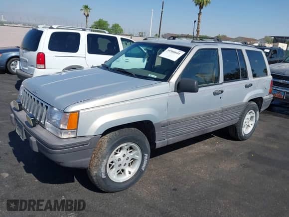 1994 Jeep Grand Cherokee Laredo with VIN 1J4GZ58S4RC325909, listed as a IAAI auction lot 39580601 with 162,952 mi miles and . Bid and sale history available at DreamBid. Image 2.