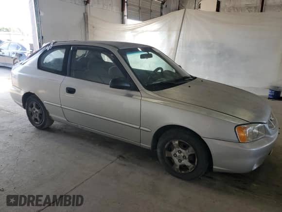 2002 Hyundai Accent GS z VIN KMHCG35C32U190168, wystawiony jako Copart lot #71414935 z przebiegiem 205 445 mil mil oraz Szkoda całkowita • Salvage title. Historia ofert i sprzedaży dostępna na DreamBid. Obrazek 4.