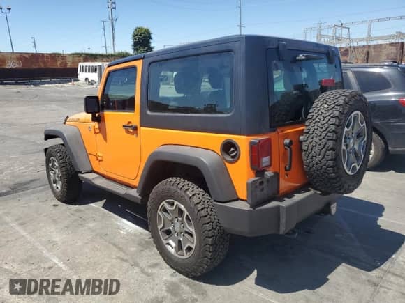 2013 Jeep Wrangler Rubicon 10th Anniversary with VIN 1C4BJWCG5DL502038, listed as a Copart auction lot 64360255 with 46,288 mi miles and Salvage title. Bid and sale history available at DreamBid. Image 2.