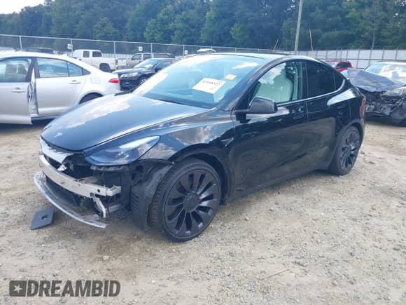 2021 Tesla Model Y Performance with VIN 5YJYGDEF1MF121694, listed as a IAAI auction lot 43168322 with 39,243 mi miles and . Bid and sale history available at DreamBid. Image 2.