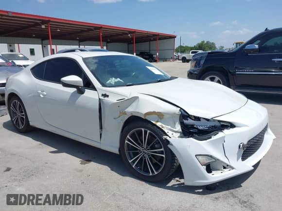 2015 Scion FR-S z VIN JF1ZNAA15F9700953, wystawiony jako IAAI lot #42691821 z przebiegiem 124 706 mil mil oraz . Historia ofert i sprzedaży dostępna na DreamBid. Obrazek 1.