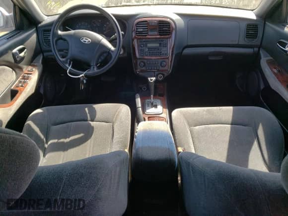 2003 Hyundai Sonata GLS z VIN KMHWF35H63A832574, wystawiony jako Copart lot #52094854 z przebiegiem 163 848 mil mil oraz Nie do naprawy • Non repairable. Historia ofert i sprzedaży dostępna na DreamBid. Obrazek 8.