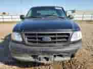 2000 Ford F-150 XL z VIN 1FTZX1729YNA19838, wystawiony jako Copart lot #58537575 z przebiegiem 254 403 mil mil oraz Czysty tytuł • Clean title. Historia ofert i sprzedaży dostępna na DreamBid. Obrazek 5.
