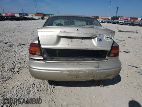 2002 Saturn SL с VIN 1G8ZH528X2Z115228, выставлен на аукционе Copart как лот 71235424 с пробегом 64 375 миль миль и Списание • Salvage title. История ставок и продаж доступна на DreamBid. Изображение 6.