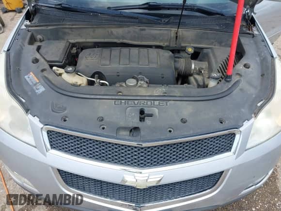 2012 Chevrolet Traverse 1LT z VIN 1GNKRGED2CJ173995, wystawiony jako IAAI lot #42385475 z przebiegiem 222 978 mil mil oraz . Historia ofert i sprzedaży dostępna na DreamBid. Obrazek 10.