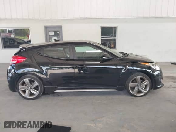 2013 Hyundai Veloster Turbo с VIN KMHTC6AEXDU167848, выставлен на аукционе IAAI как лот 43353403 с пробегом 84 077 миль миль и . История ставок и продаж доступна на DreamBid. Изображение 14.