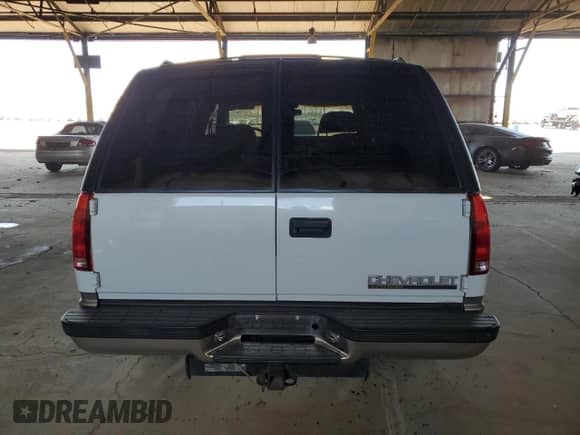 1999 Chevrolet Tahoe with VIN 1GNEC13R6XJ546228, listed as a Copart auction lot 47996675 with 133,028 mi miles and Salvage title. Bid and sale history available at DreamBid. Image 6.