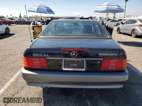 1992 Mercedes-Benz SL с VIN WDBFA66E1NF058408, выставлен на аукционе Copart как лот 75694294 с пробегом 169 308 миль миль и Чистый • Clean title. История ставок и продаж доступна на DreamBid. Изображение 6.