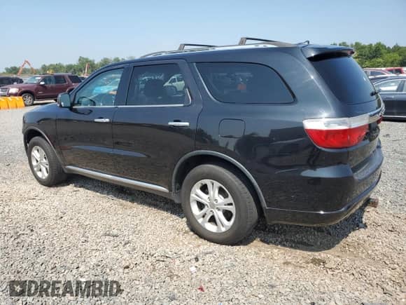 2013 Dodge Durango Crew with VIN 1C4RDJDG3DC664970, listed as a Copart auction lot 68870115 with 243,617 mi miles and Salvage title. Bid and sale history available at DreamBid. Image 2.