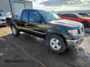 2005 Nissan Frontier SE z VIN 1N6AD06U95C411015, wystawiony jako Copart lot #84220545 z przebiegiem 167 313 mil mil oraz Szkoda całkowita • Salvage title. Historia ofert i sprzedaży dostępna na DreamBid. Obrazek 4.