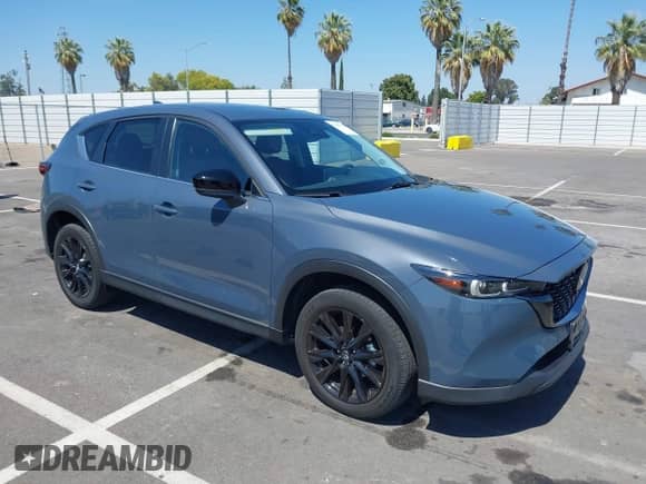 2022 Mazda CX-5 S Carbon Edition z VIN JM3KFBCM7N1601447, wystawiony jako IAAI lot #42463014 z przebiegiem 37 126 mil mil oraz . Historia ofert i sprzedaży dostępna na DreamBid. Obrazek 1.