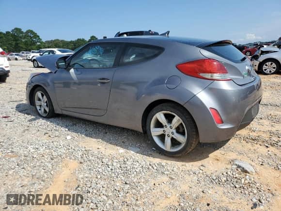 2012 Hyundai Veloster w/Black Int z VIN KMHTC6AD7CU028864, wystawiony jako Copart lot #66377895 z przebiegiem 130 440 mil mil oraz Szkoda całkowita • Salvage title. Historia ofert i sprzedaży dostępna na DreamBid. Obrazek 2.