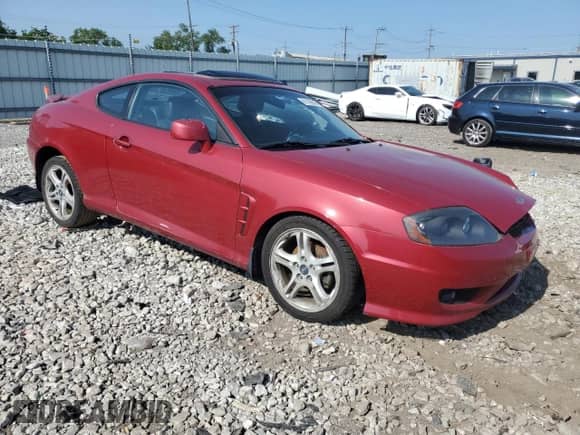 2006 Hyundai Tiburon GT с VIN KMHHN65FX6U190598, выставлен на аукционе Copart как лот 61143675 с пробегом Не указан миль и Списание • Salvage title. История ставок и продаж доступна на DreamBid. Изображение 4.