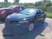 2020 Toyota Camry LE with VIN 4T1C11AKXLU877796, listed as a IAAI auction lot 43384594 with 78,546 mi miles and . Bid and sale history available at DreamBid. Image 2.