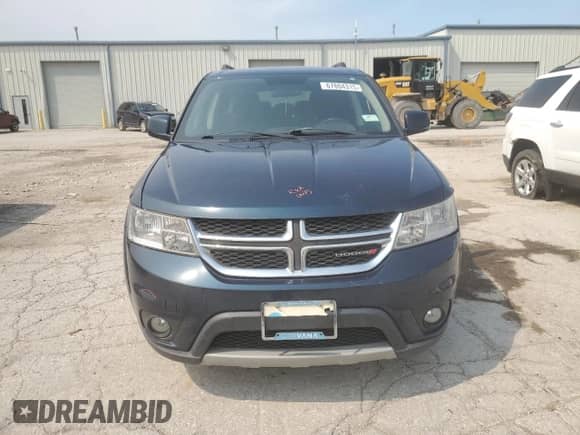 2014 Dodge Journey SXT with VIN 3C4PDCBBXET171609, listed as a Copart auction lot 67804315 with 127,593 mi miles and Salvage title. Bid and sale history available at DreamBid. Image 5.
