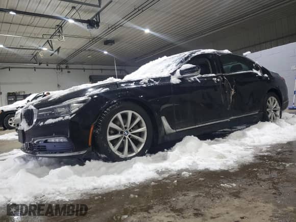 2017 BMW 7 Series 740i xDrive with VIN WBA7E4C55HGU99781, listed as a Copart auction lot 42806505 with 74,825 mi miles and Salvage title. Bid and sale history available at DreamBid. Image 1.