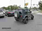 2004 Jeep Wrangler X z VIN 1J4FA39S64P753911, wystawiony jako Copart lot #86479285 z przebiegiem 138 801 mil mil oraz Czysty tytuł • Clean title. Historia ofert i sprzedaży dostępna na DreamBid. Obrazek 4.