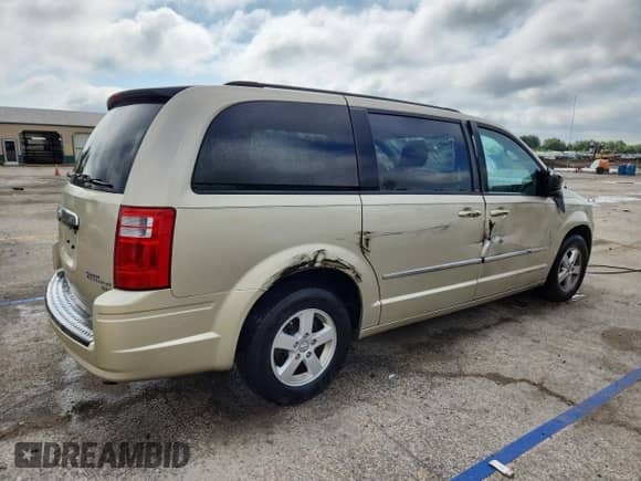 2010 Dodge Grand Caravan SXT с VIN 2D4RN5D19AR220191, выставлен на аукционе Copart как лот 69233045 с пробегом 58 716 миль миль и Списание • Salvage title. История ставок и продаж доступна на DreamBid. Изображение 3.