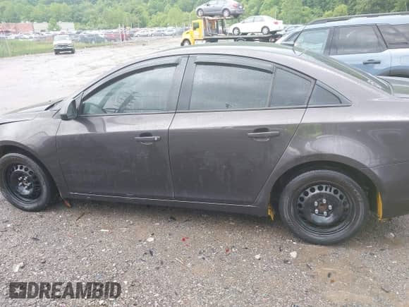 2014 Chevrolet Cruze LS with VIN 1G1PB5SH9E7309367, listed as a IAAI auction lot 42382905 with 210,439 mi miles and . Bid and sale history available at DreamBid. Image 15.