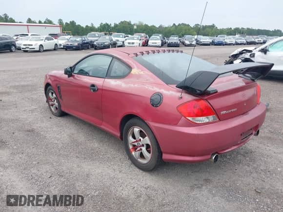 2005 Hyundai Tiburon GS z VIN KMHHM65D35U168510, wystawiony jako IAAI lot #42691110 z przebiegiem 128 386 mil mil oraz . Historia ofert i sprzedaży dostępna na DreamBid. Obrazek 3.