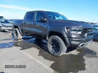 2023 Ram 1500 TRX z VIN 1C6SRFU99PN500611, wystawiony jako IAAI lot #42971955 z przebiegiem 33 829 mil mil oraz . Historia ofert i sprzedaży dostępna na DreamBid. Obrazek 1.