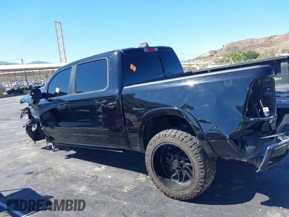 2021 Ram 1500 Laramie with VIN 1C6SRFJTXMN823383, listed as a IAAI auction lot 43353162 with 82,117 mi miles and . Bid and sale history available at DreamBid. Image 13.