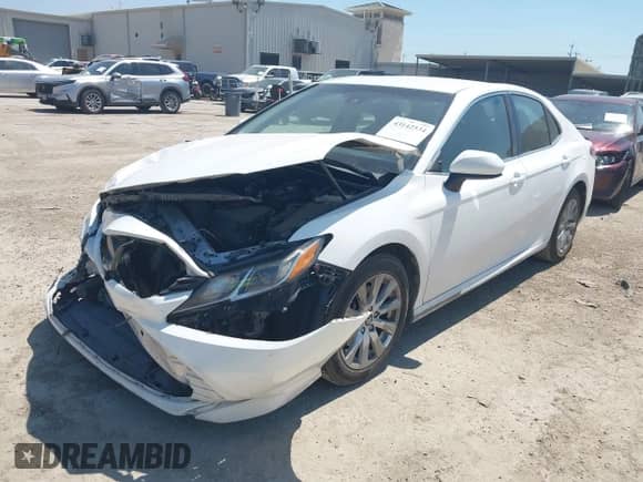 2018 Toyota Camry SE z VIN 4T1B11HK0JU023012, wystawiony jako IAAI lot #43142534 z przebiegiem 122 170 mil mil oraz . Historia ofert i sprzedaży dostępna na DreamBid. Obrazek 2.