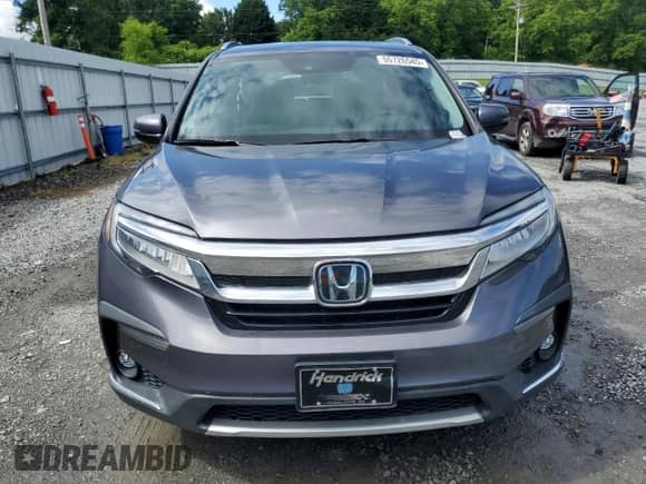 2021 Honda Pilot Touring 8-Passenger z VIN 5FNYF5H92MB037480, wystawiony jako Copart lot #55726545 z przebiegiem 52 910 mil mil oraz Szkoda całkowita • Salvage title. Historia ofert i sprzedaży dostępna na DreamBid. Obrazek 5.