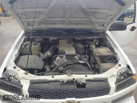 2012 Chevrolet Colorado Work Truck z VIN 1GCCSBF97C8138004, wystawiony jako Copart lot #66626765 z przebiegiem 209 197 mil mil oraz Czysty tytuł • Clean title. Historia ofert i sprzedaży dostępna na DreamBid. Obrazek 11.