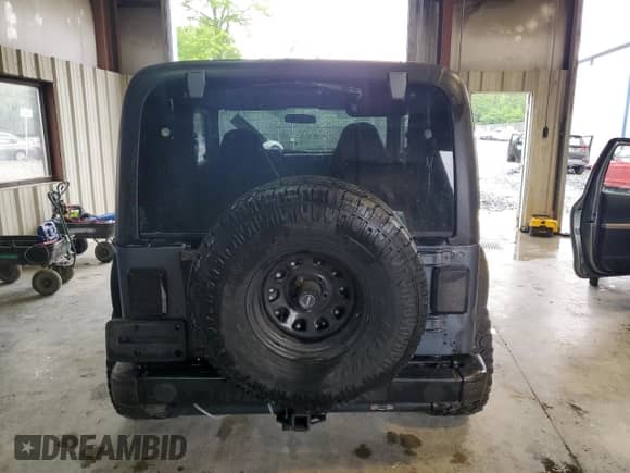 2001 Jeep Wrangler SE with VIN 1J4FA29P11P358326, listed as a Copart auction lot 56181715 with 201,929 mi miles and Clean title. Bid and sale history available at DreamBid. Image 6.
