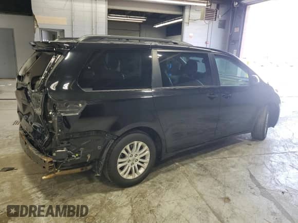 2014 Toyota Sienna XLE with VIN 5TDYK3DC8ES464113, listed as a Copart auction lot 82118295 with 142,513 mi miles and Salvage title. Bid and sale history available at DreamBid. Image 3.