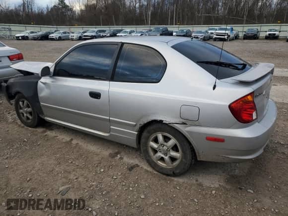 2004 Hyundai Accent GL z VIN KMHCG35C64U279929, wystawiony jako Copart lot #81661824 z przebiegiem 99 222 mil mil oraz Szkoda całkowita • Salvage title. Historia ofert i sprzedaży dostępna na DreamBid. Obrazek 2.