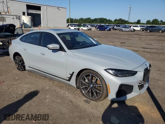 2022 BMW i4 eDrive40 с VIN WBY73AW09NFN24897, выставлен на аукционе Copart как лот 61415415 с пробегом 32 599 миль миль и Списание • Salvage title. История ставок и продаж доступна на DreamBid. Изображение 4.