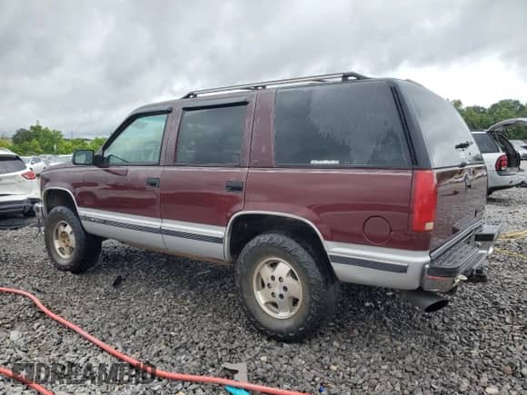 1995 Chevrolet Tahoe with VIN 1GNEK13K9SJ451466, listed as a Copart auction lot 59164545 with 165,537 mi miles and Salvage title. Bid and sale history available at DreamBid. Image 2.