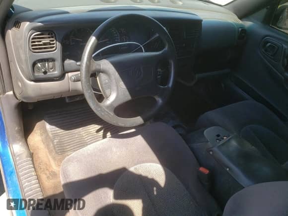 1999 Dodge Dakota SLT with VIN 1B7GL22XXXS147047, listed as a Copart auction lot 57552215 with 288,196 mi miles and Salvage title. Bid and sale history available at DreamBid. Image 8.