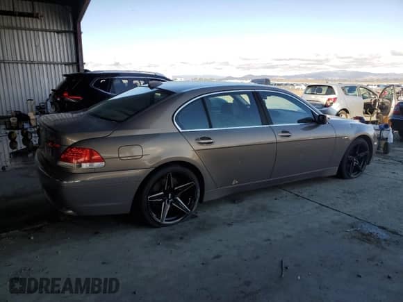 2004 BMW 7 Series 745Li with VIN WBAGN63404DS45720, listed as a Copart auction lot 82421485 with 173,177 mi miles and Salvage title. Bid and sale history available at DreamBid. Image 3.