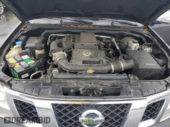 2010 Nissan Frontier LE with VIN 1N6AD0EV0AC419279, listed as a Copart auction lot 82463385 with 83,722 mi miles and Salvage title. Bid and sale history available at DreamBid. Image 11.