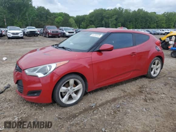 2013 Hyundai Veloster w/Black Int z VIN KMHTC6AD5DU173242, wystawiony jako Copart lot #54733125 z przebiegiem 157 766 mil mil oraz Czysty tytuł • Clean title. Historia ofert i sprzedaży dostępna na DreamBid. Obrazek 1.