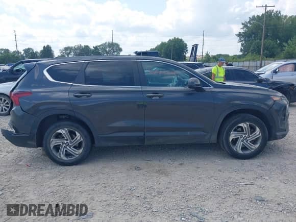 2021 Hyundai Santa Fe SE z VIN 5NMS14AJ4MH322800, wystawiony jako IAAI lot #42923868 z przebiegiem 104 124 mil mil oraz . Historia ofert i sprzedaży dostępna na DreamBid. Obrazek 13.