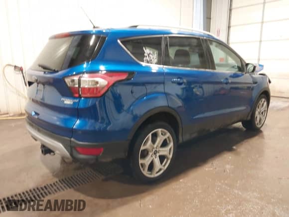 2017 Ford Escape Titanium with VIN 1FMCU9J94HUB66556, listed as a IAAI auction lot 42620675 with 125,051 mi miles and . Bid and sale history available at DreamBid. Image 4.