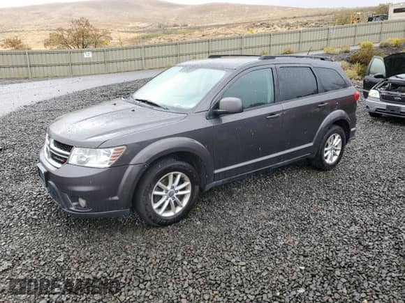 2015 Dodge Journey SXT with VIN 3C4PDCBG0FT718061, listed as a Copart auction lot 82205215 with 174,494 mi miles and Clean title. Bid and sale history available at DreamBid. Image 1.