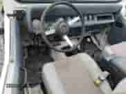 1991 Jeep Wrangler с VIN 2J4FY29S5MJ117273, выставлен на аукционе Copart как лот 79791584 с пробегом 1 995 086 миль миль и На запчасти • Non repairable. История ставок и продаж доступна на DreamBid. Изображение 8.