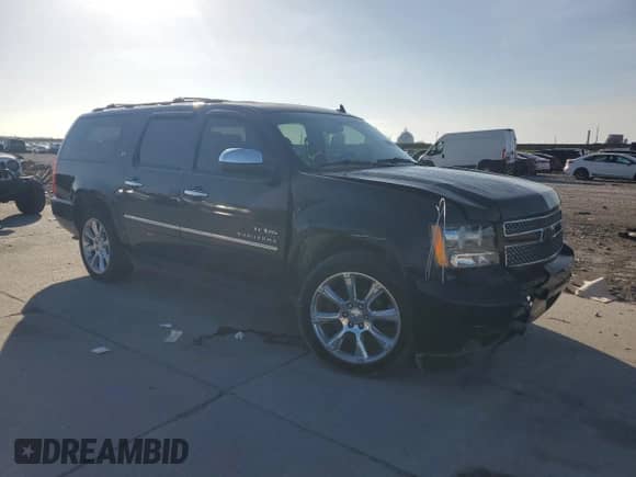 2011 Chevrolet Suburban LTZ with VIN 1GNSCKE05BR320599, listed as a Copart auction lot 64181955 with 196,199 mi miles and Salvage title. Bid and sale history available at DreamBid. Image 4.