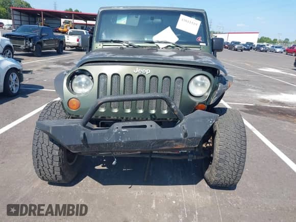 2007 Jeep Wrangler Unlimited Sahara с VIN 1J4GA59157L198095, выставлен на аукционе IAAI как лот 43011519 с пробегом 198 022 миль миль и . История ставок и продаж доступна на DreamBid. Изображение 6.